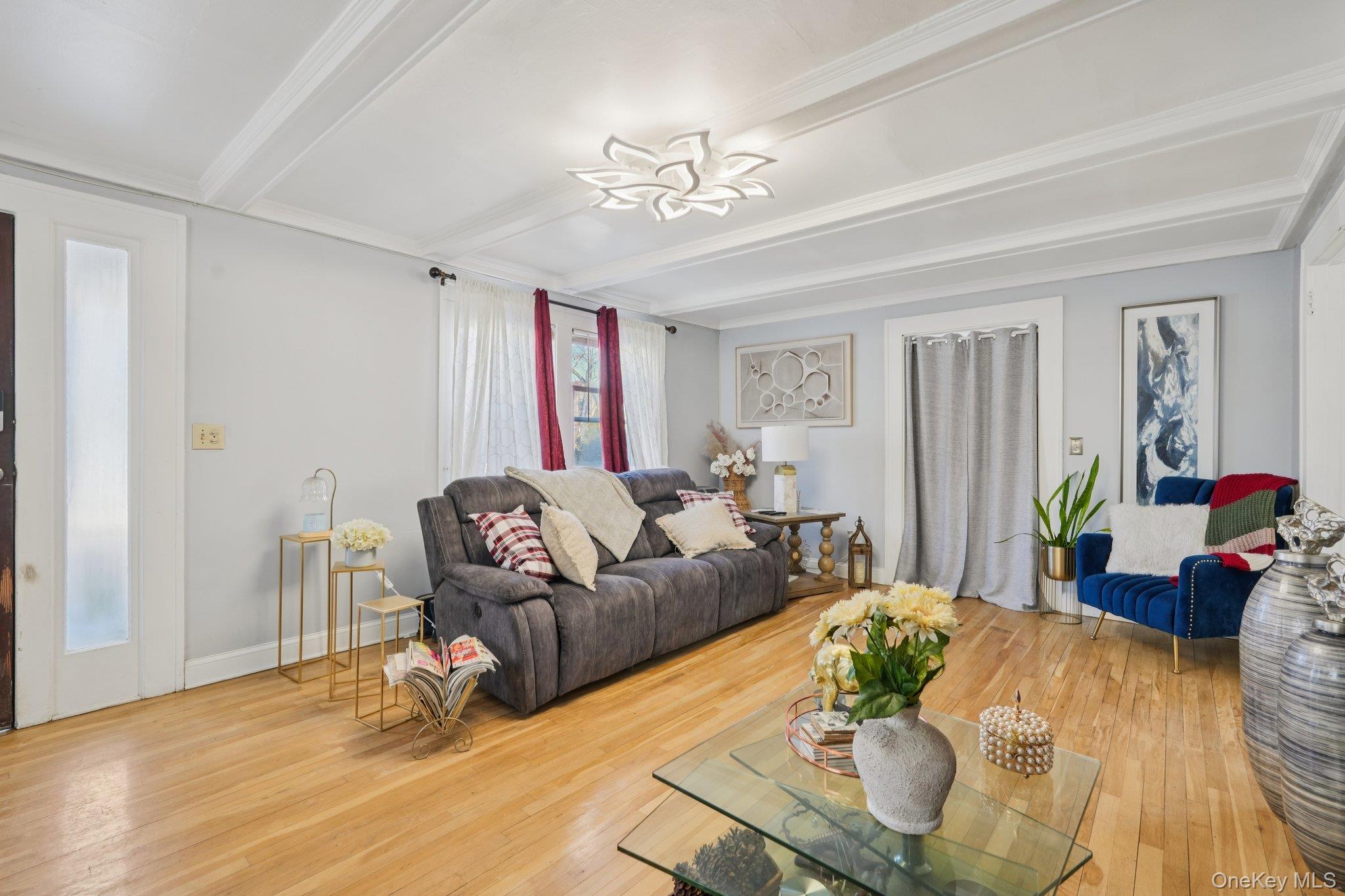 30 Ferdinand Place New Rochelle, NY 10801 - Photo 5 of 46 a living room with furniture and a chandelier