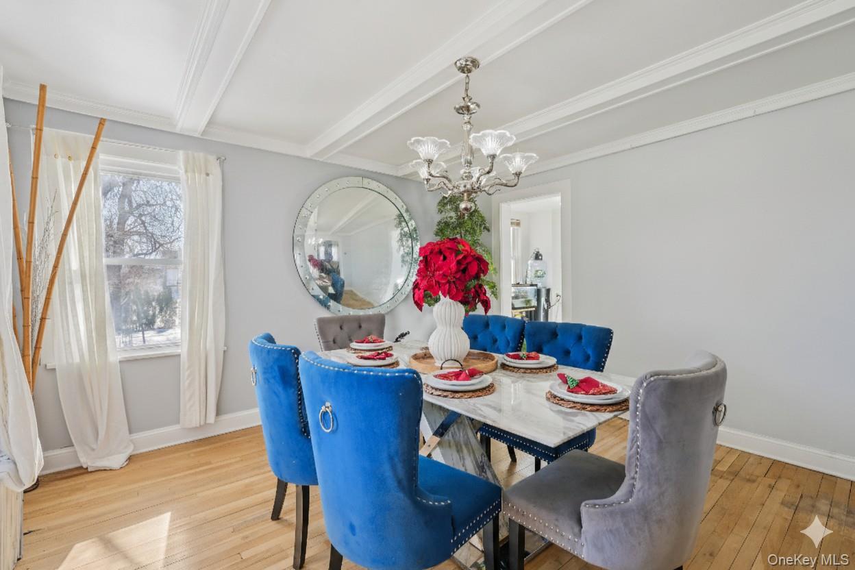 30 Ferdinand Place New Rochelle, NY 10801 - Photo 8 of 46 a view of a dining room with furniture a chandelier and wooden floor