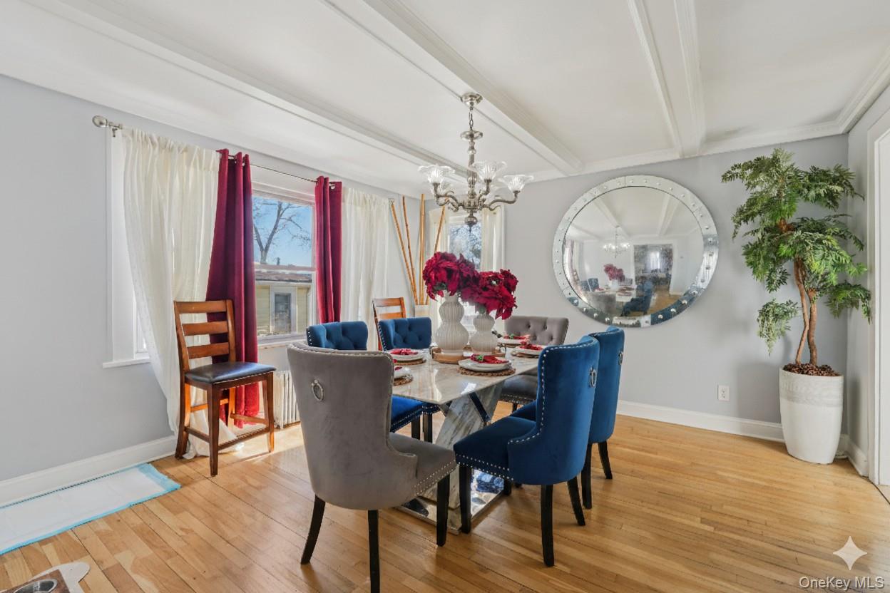30 Ferdinand Place New Rochelle, NY 10801 - Photo 9 of 46 a view of a dining room with furniture a chandelier and wooden floor