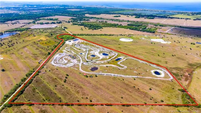 an aerial view of residential building and ocean view