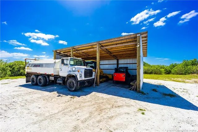 a view of a big room with bed and balcony