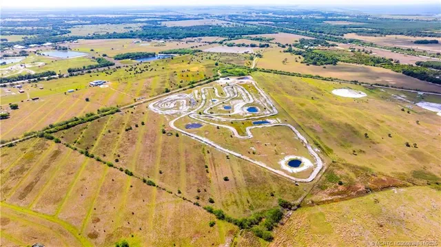 an aerial view of residential building and ocean view