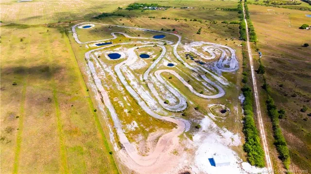 a bathroom with a tub and mirror