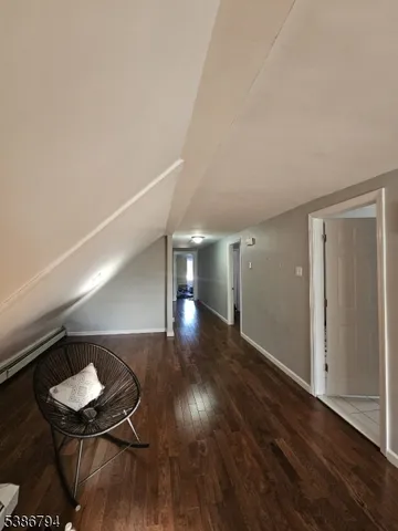 a view of a livingroom with furniture and wooden floor