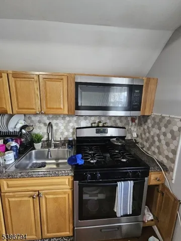 a kitchen with a stove and a microwave