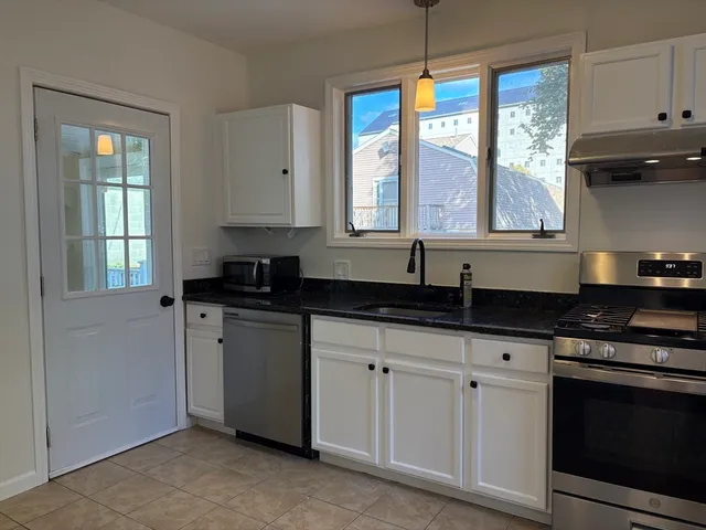 a bathroom with a sink and mirror