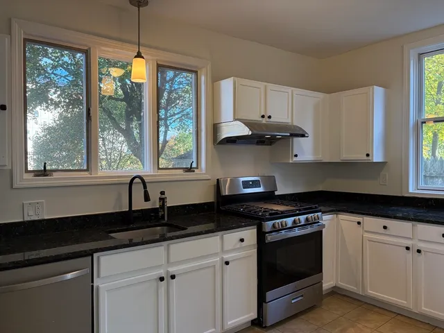 a view of staircase with wooden floor and staircase
