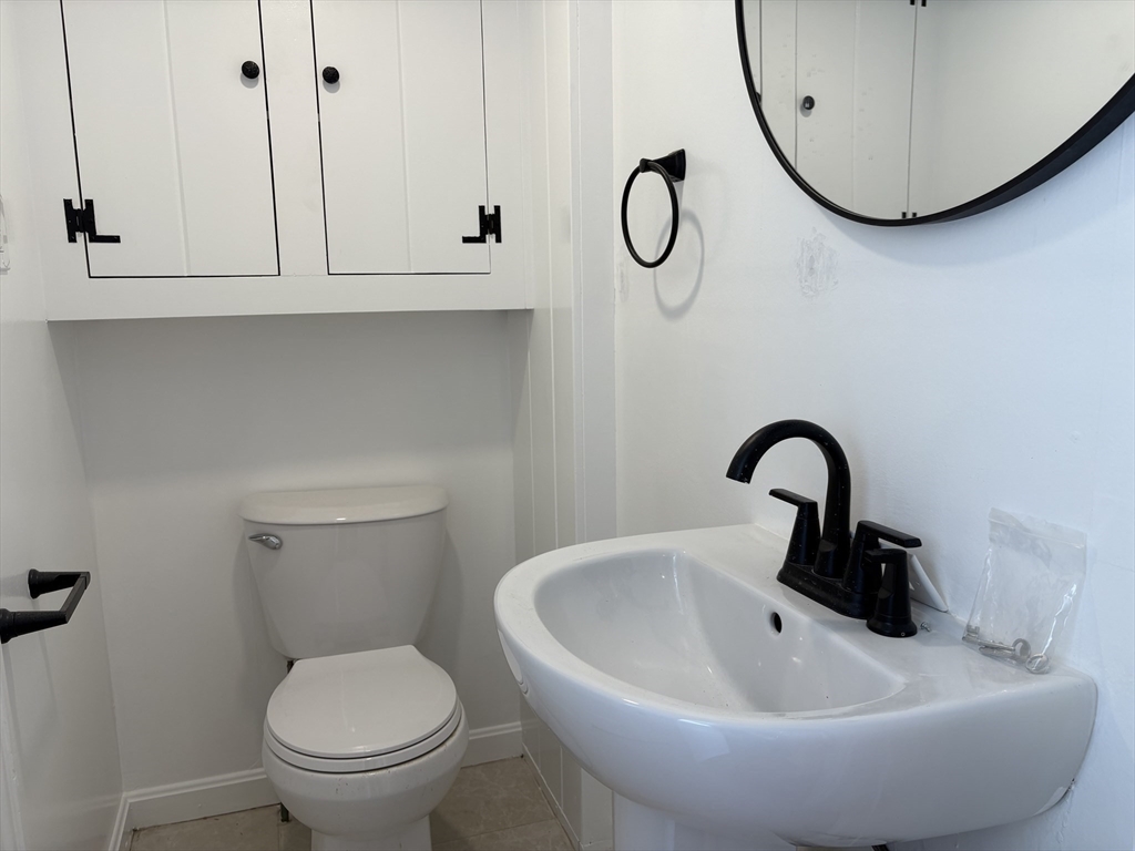 57 Coburn Avenue, Unit 2 Worcester, MA 01604 - Photo 15 of 42 a bathroom with a sink and a mirror