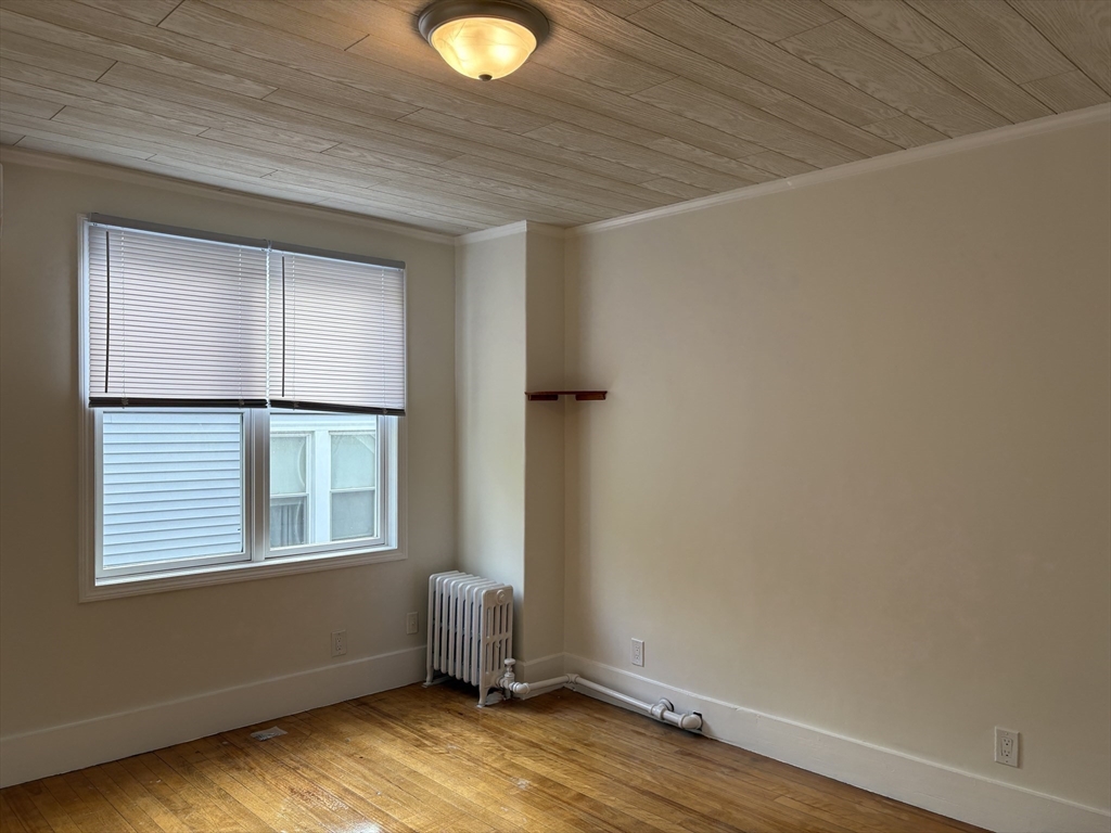 57 Coburn Avenue, Unit 2 Worcester, MA 01604 - Photo 20 of 42 an empty room with windows
