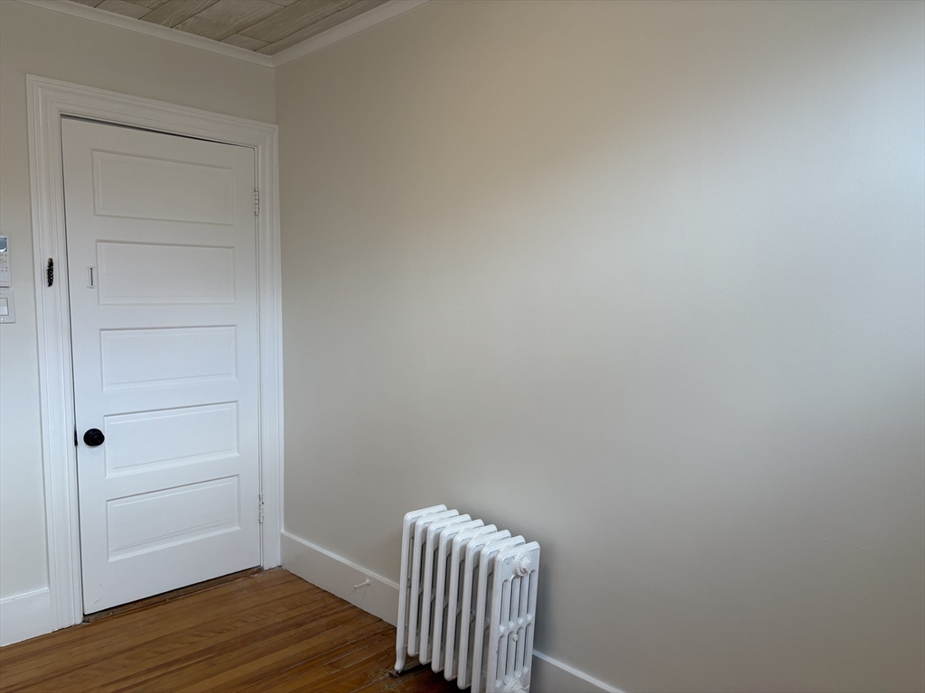 57 Coburn Avenue, Unit 2 Worcester, MA 01604 - Photo 30 of 42 a view of room with wooden floor