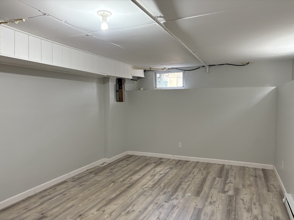 57 Coburn Avenue, Unit 2 Worcester, MA 01604 - Photo 33 of 42 a view of empty room with wooden floor
