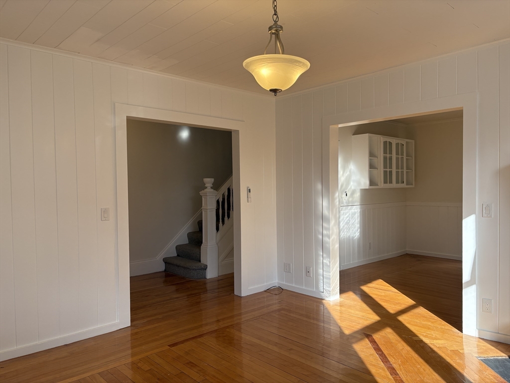 57 Coburn Avenue, Unit 2 Worcester, MA 01604 - Photo 5 of 42 a view of a room with wooden floor and stairs