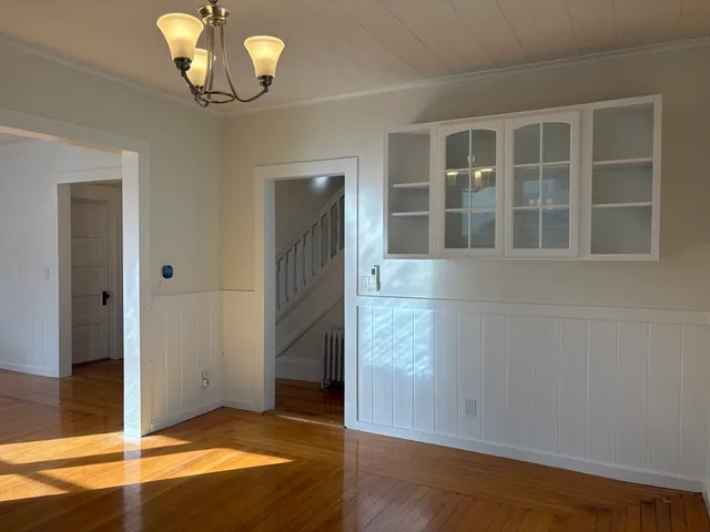a kitchen with granite countertop a stove a sink and a window