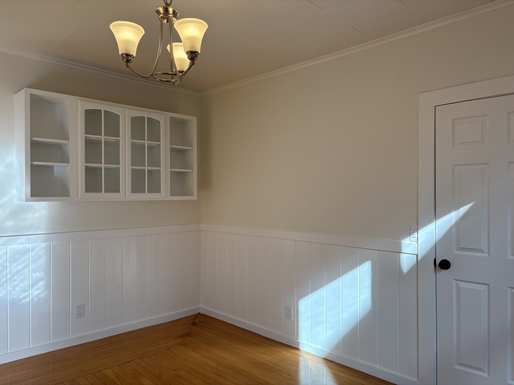 57 Coburn Avenue, Unit 2 Worcester, MA 01604 - Photo 8 of 42 a view of a room with a ceiling fan and wooden floor