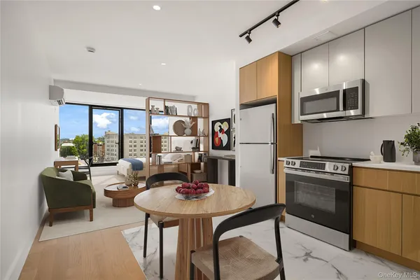 a kitchen with stainless steel appliances kitchen island granite countertop a refrigerator a stove a sink dishwasher with a dining table and chairs with wooden floor