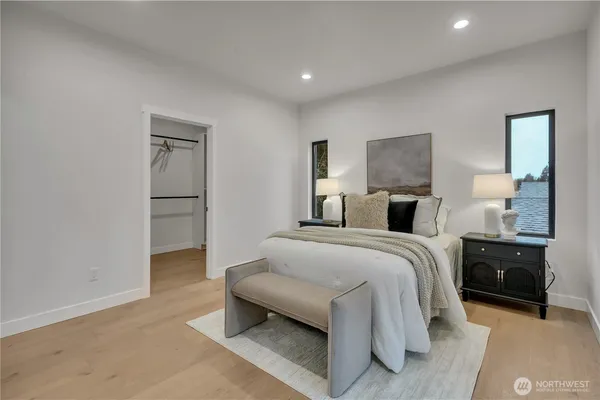 a spacious bedroom with a bed and a shower