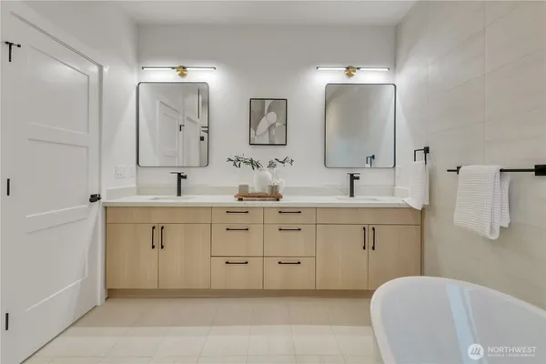a bathroom with a glass shower door
