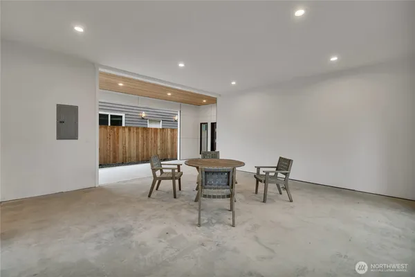 a dining room with furniture and window