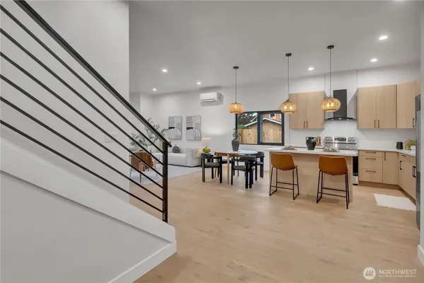 a kitchen with stainless steel appliances kitchen island granite top and refrigerator