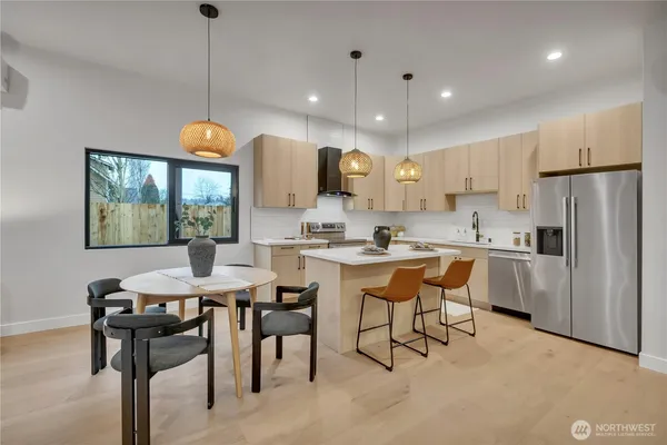 a kitchen with a sink and white cabinets