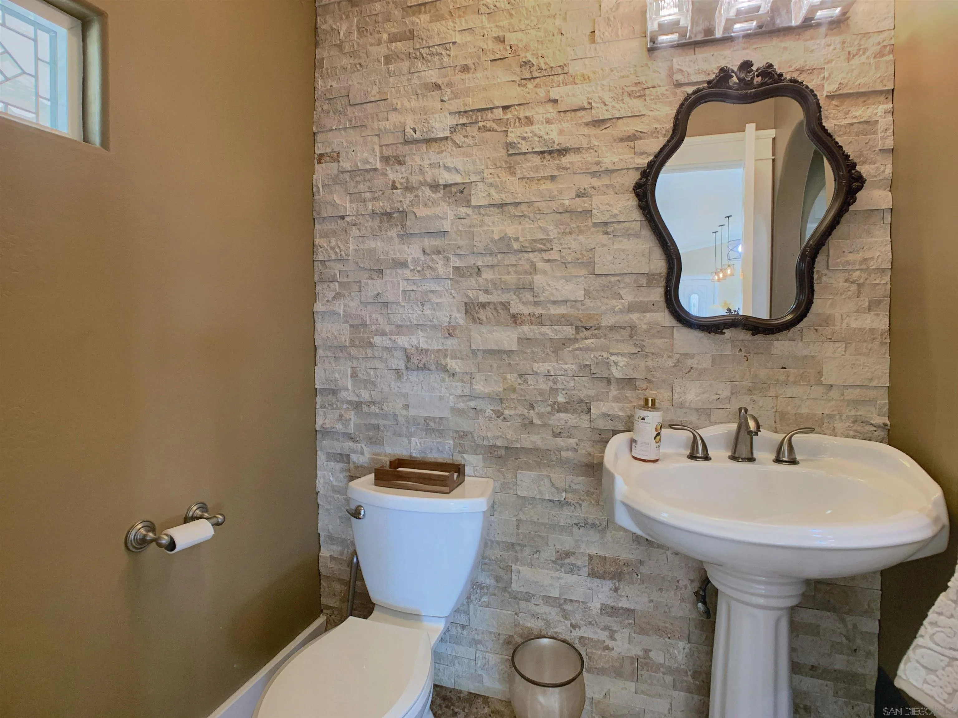 205 Highline Trail El Cajon, CA 92021 - Photo 15 of 45 a bathroom with a toilet sink and mirror