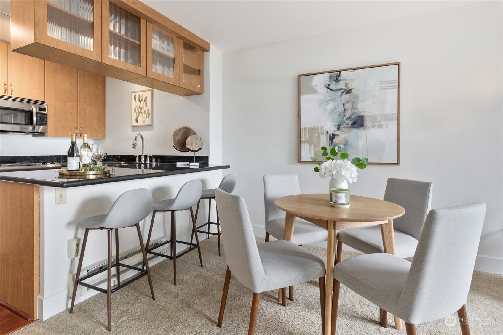 1105 Spring Street, Unit 902 Seattle, WA 98104 - Photo 7 of 21 a dining room with furniture and window
