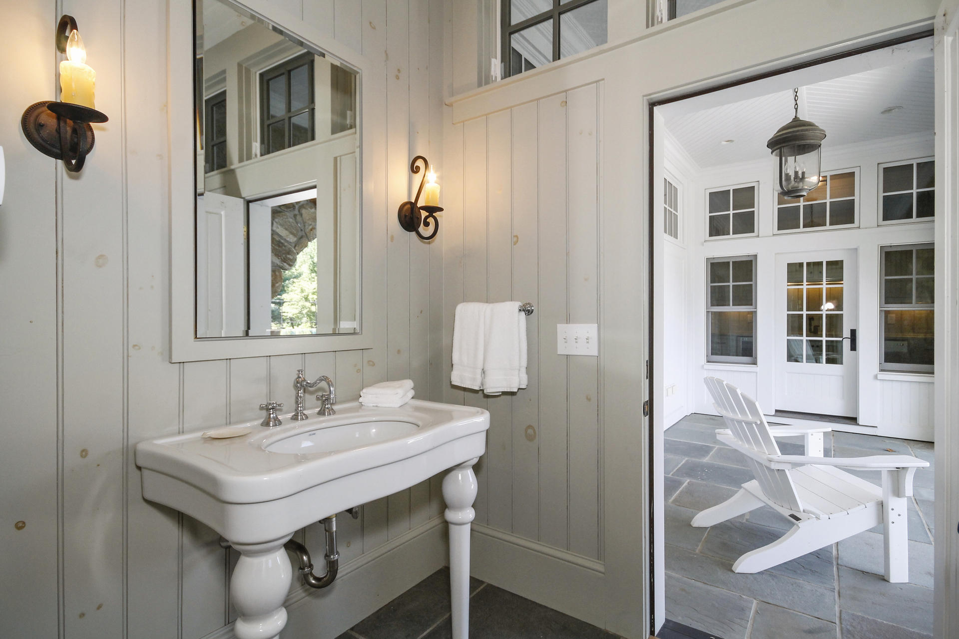 163 Long Neck Point Road Darien, CT 06820 - Photo 18 of 24 a bathroom with a sink and a mirror