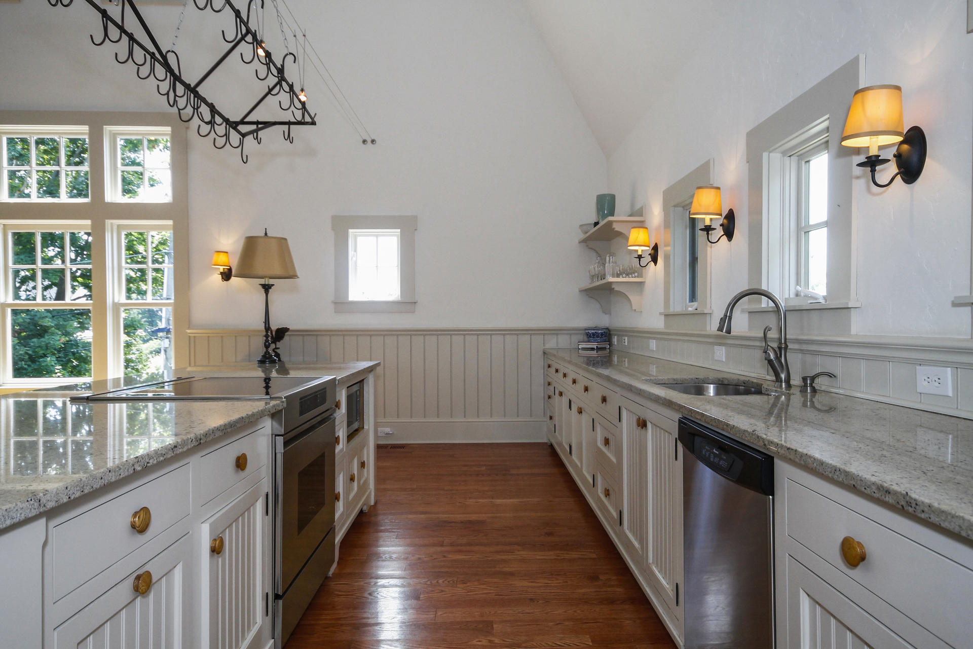 163 Long Neck Point Road Darien, CT 06820 - Photo 10 of 24 a kitchen with granite countertop a sink and a wooden floor