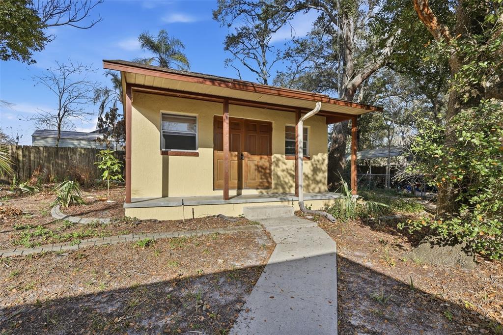 244 Angeles Road DeBary, FL 32713 - Photo 37 of 41 a view of a house with a small yard and large tree