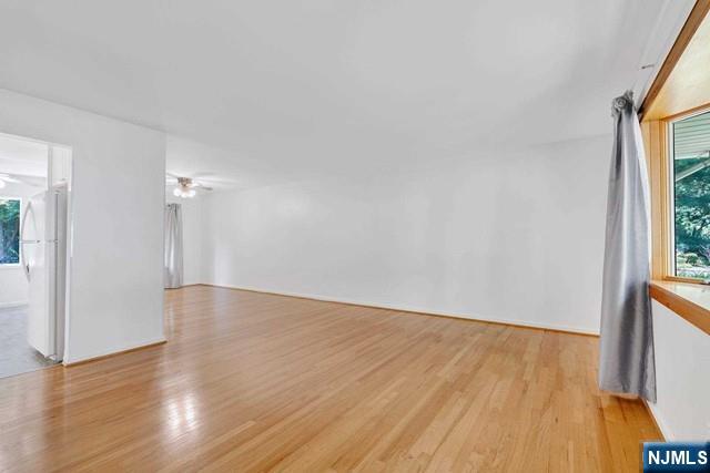 516 Knickerbocker Road Cresskill, NJ 07626 - Photo 14 of 31 a view of an empty room with wooden floor and a window