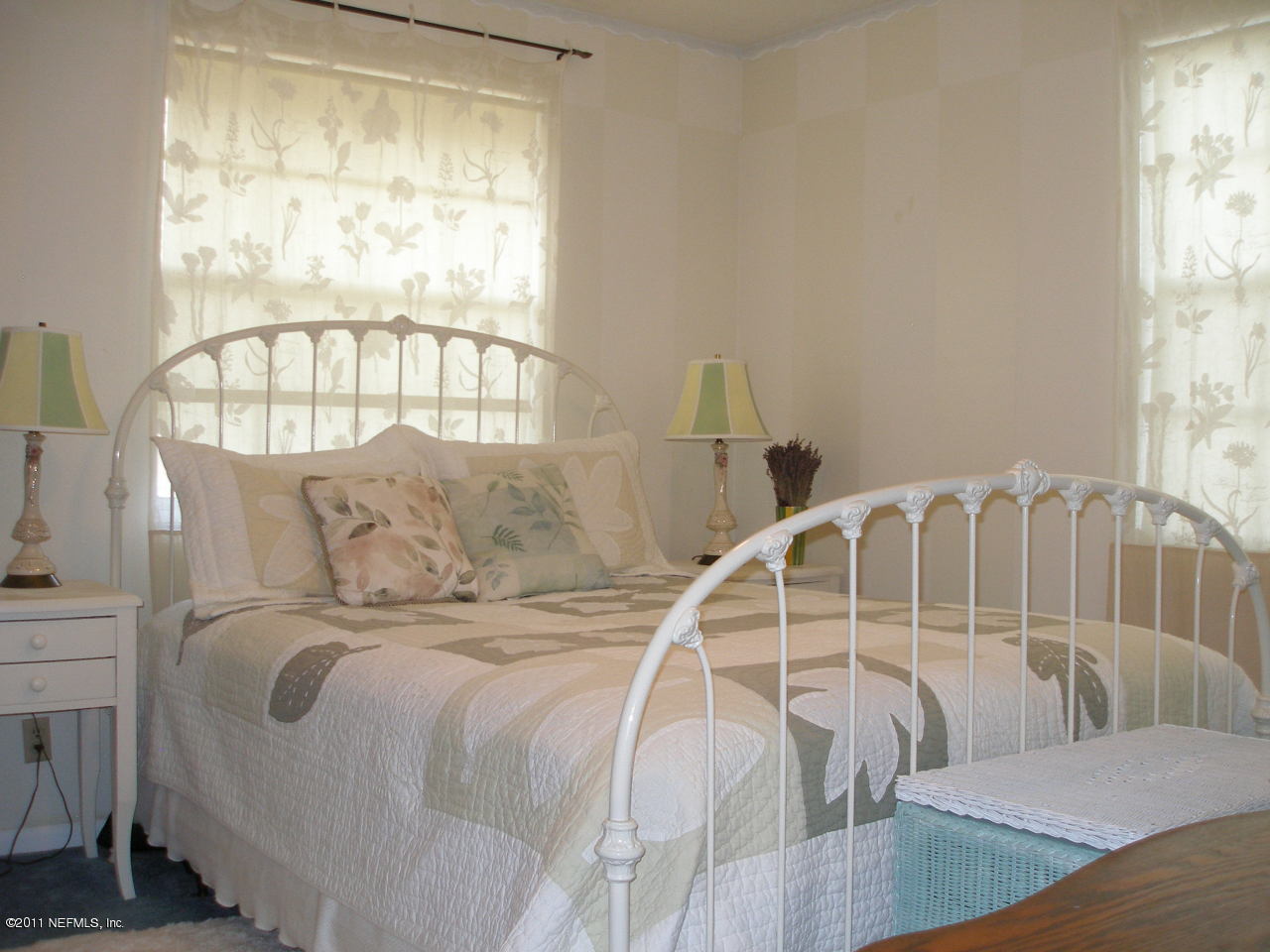 518 Gentian Road St. Augustine, FL 32086 - Photo 15 of 26 a bed sitting in a bedroom next to a window
