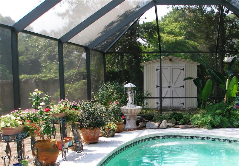 518 Gentian Road St. Augustine, FL 32086 - Photo 21 of 26 a swimming pool with outdoor seating and plants