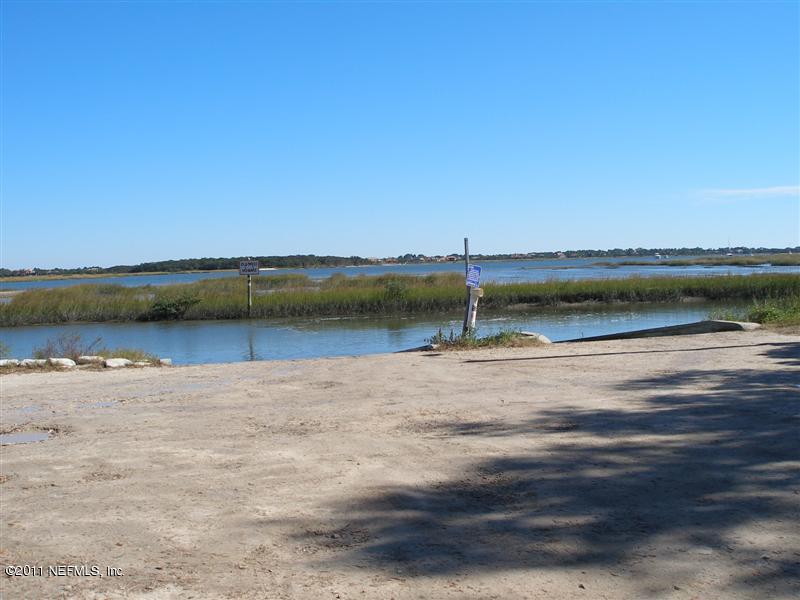 518 Gentian Road St. Augustine, FL 32086 - Photo 23 of 26 a view of a lake with houses in background