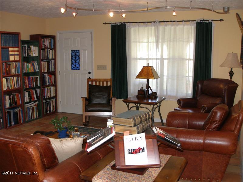 518 Gentian Road St. Augustine, FL 32086 - Photo 4 of 26 a living room with furniture and a bookshelf