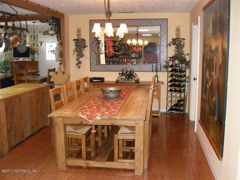 518 Gentian Road St. Augustine, FL 32086 - Photo 8 of 26 a view of a dining room with furniture window and wooden floor