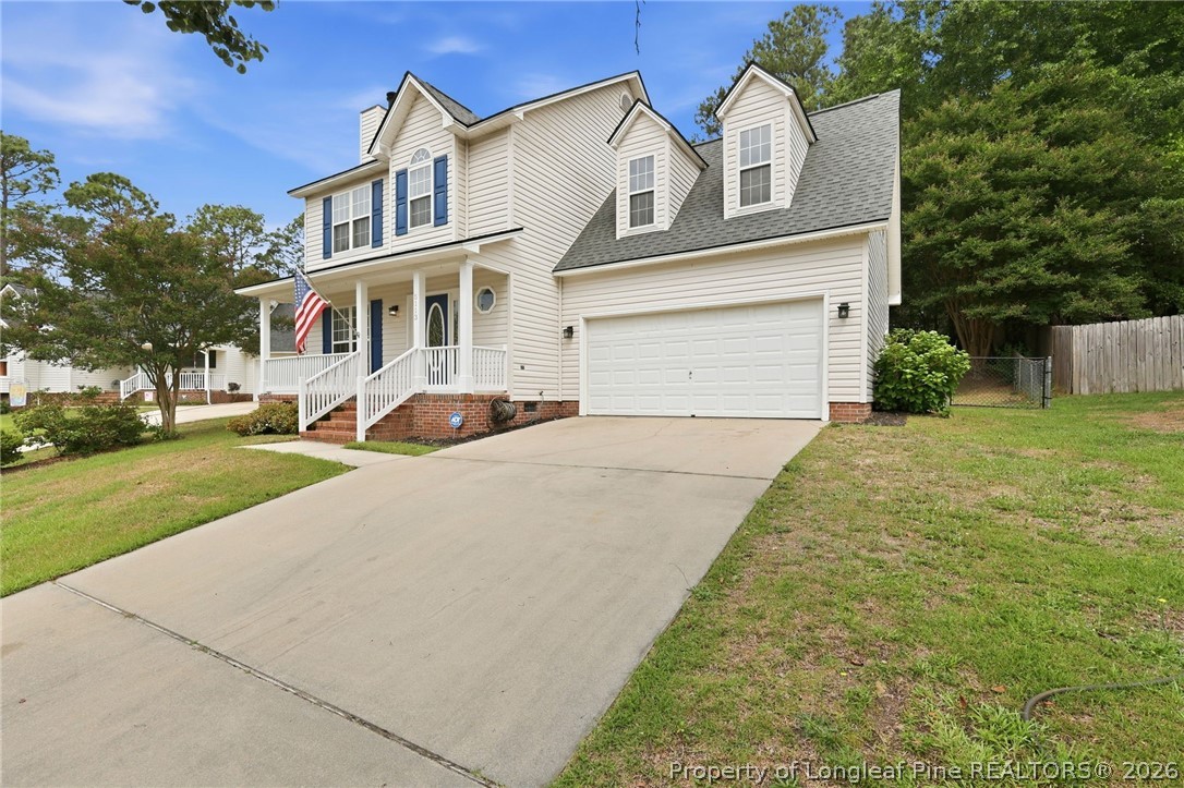 5113 Archer Road Hope Mills, NC 28348 - Photo 5 of 41 a front view of a house with a yard