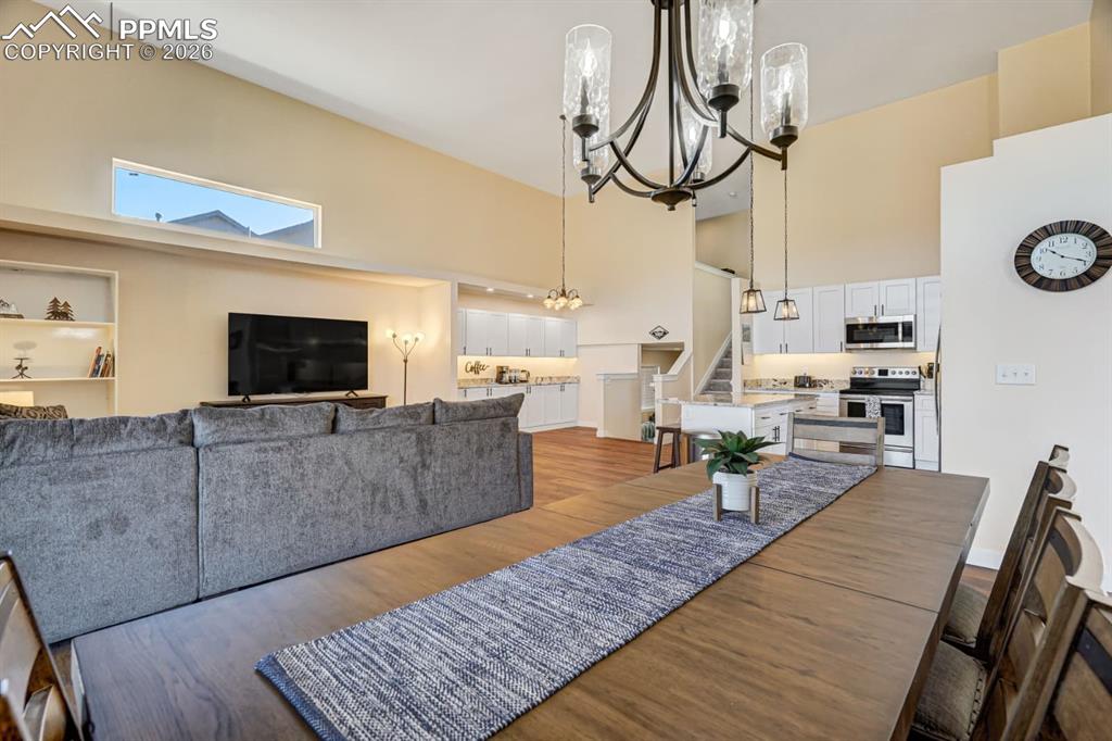 10108 Rolling Ridge Road Colorado Springs, CO 80925 - Photo 11 of 32 a living room with furniture and a flat screen tv