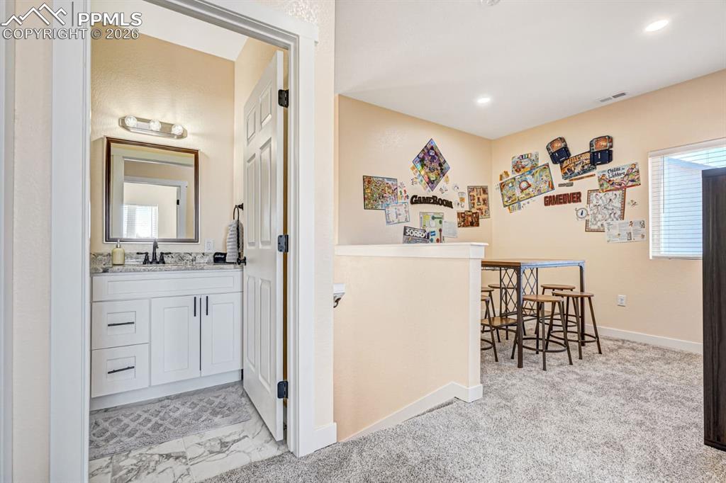 10108 Rolling Ridge Road Colorado Springs, CO 80925 - Photo 16 of 32 a view of livingroom with furniture and wooden floor
