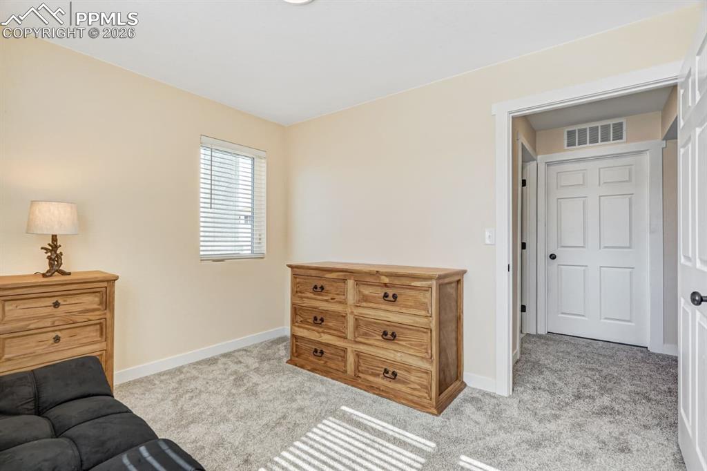 10108 Rolling Ridge Road Colorado Springs, CO 80925 - Photo 25 of 32 a view of livingroom with furniture and window