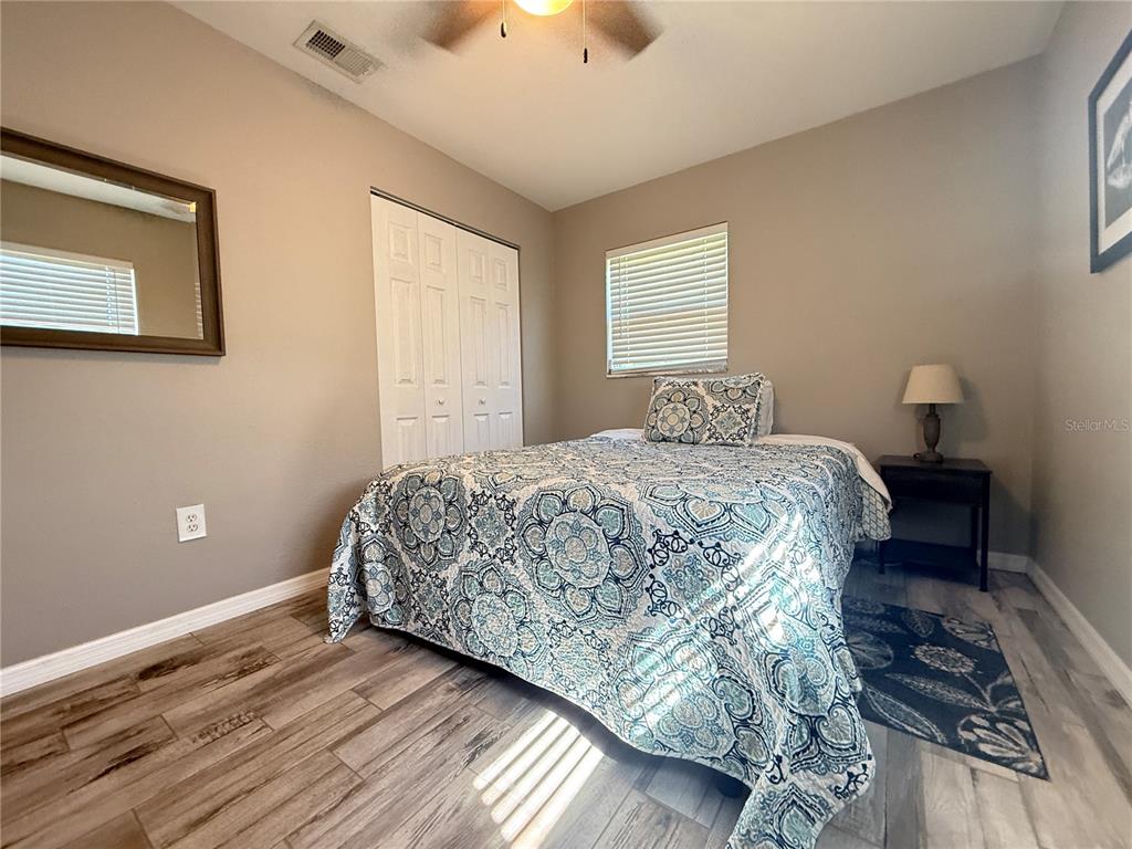 6809 Northwest 60th Street Ocala, FL 34482 - Photo 18 of 46 a bedroom with a bed and a window