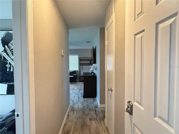 a bathroom with a granite countertop sink toilet a mirror and a bathtub