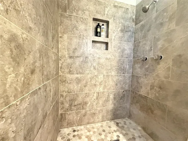 a room with a cabinet and mirror