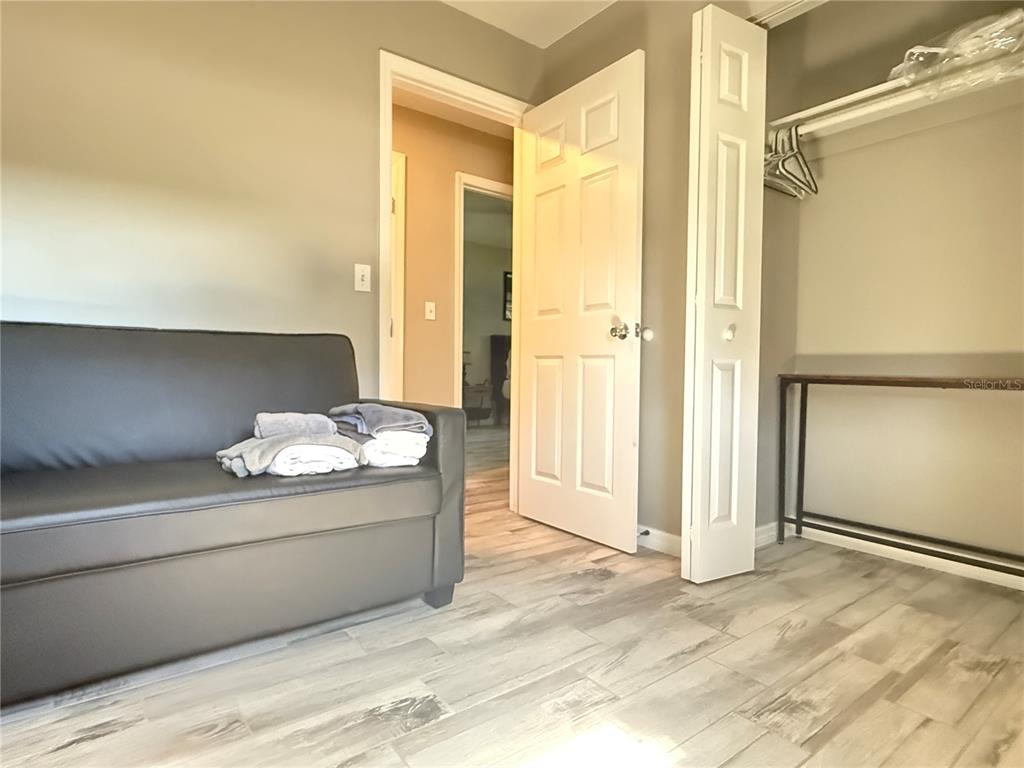 6809 Northwest 60th Street Ocala, FL 34482 - Photo 23 of 46 a room with a cabinet and mirror