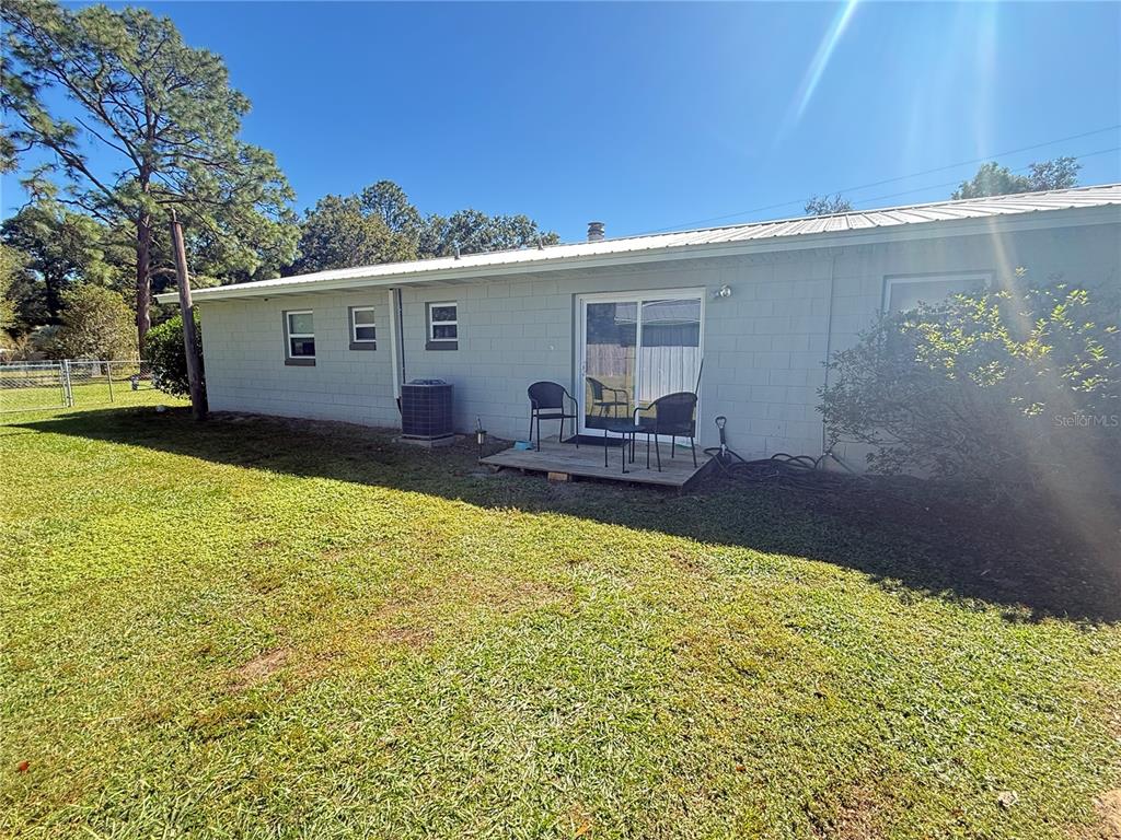 6809 Northwest 60th Street Ocala, FL 34482 - Photo 34 of 46 a view of a house with backyard and sitting area