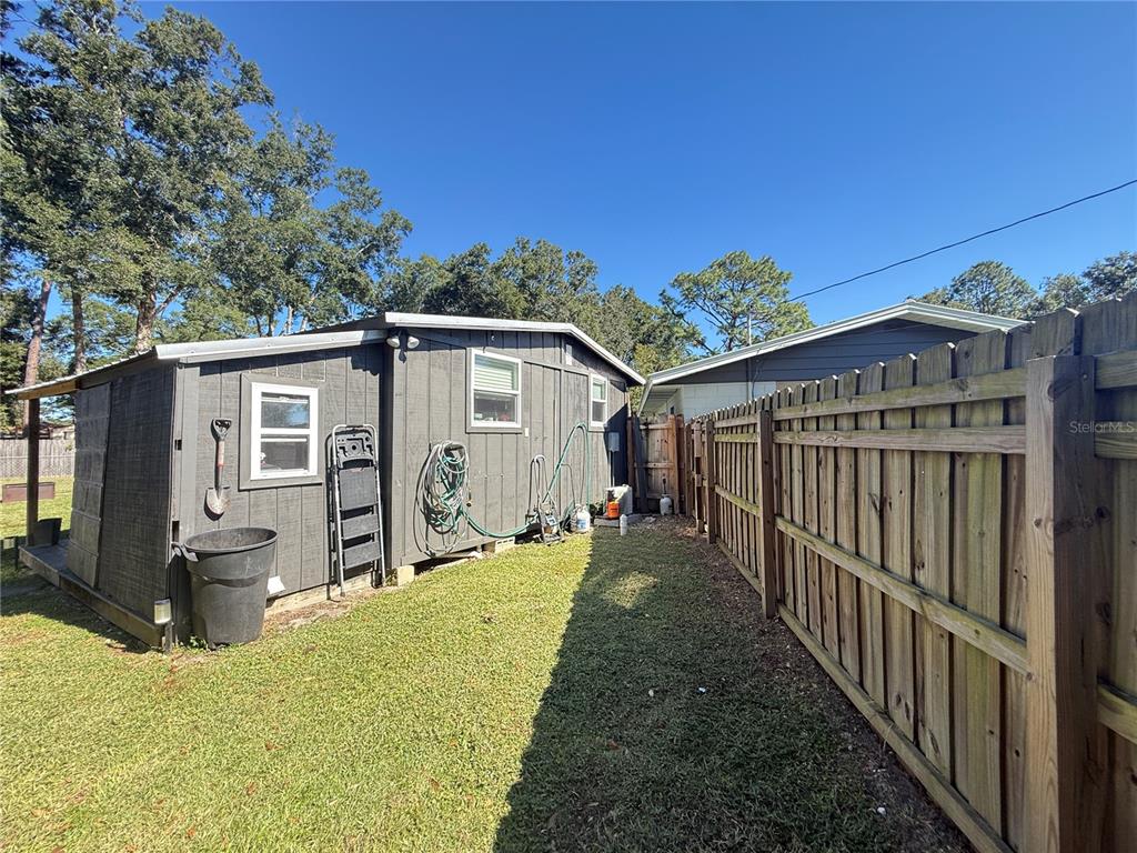 6809 Northwest 60th Street Ocala, FL 34482 - Photo 35 of 46 a view of a house with backyard and sitting area