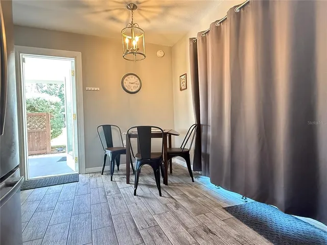 a outdoor space with a couch and wooden floor