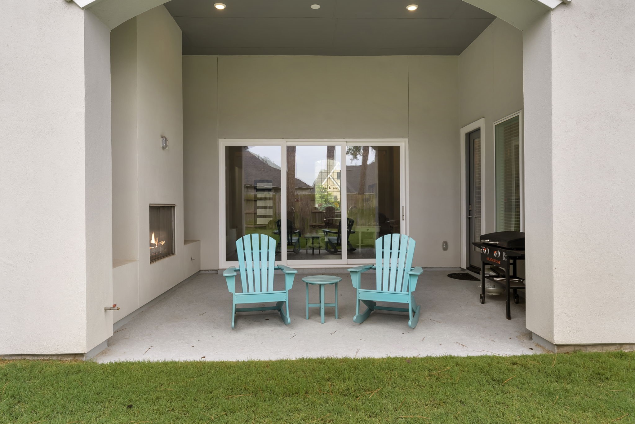 12932 Whitewater Way Conroe, TX 77302 - Photo 28 of 48 Large sliding doors connect the indoor living area to the covered outdoor patio.
