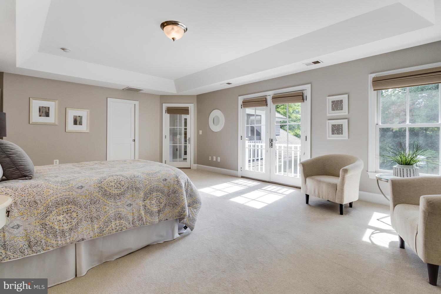 1700 Crescent Lane McLean, VA 22201 - Photo 17 of 30 a spacious bedroom with a bed and glass window