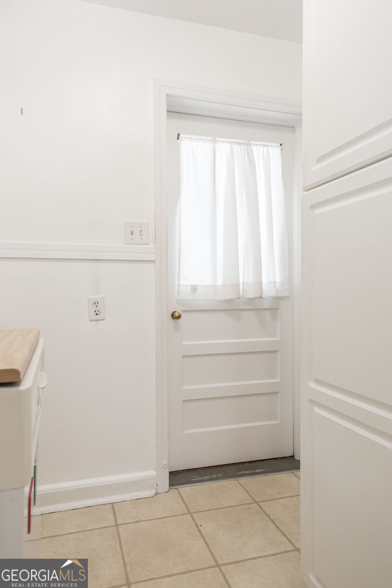 1009 Euclid Avenue Waycross, GA 31501 - Photo 11 of 35 a view of walk in closet with empty racks