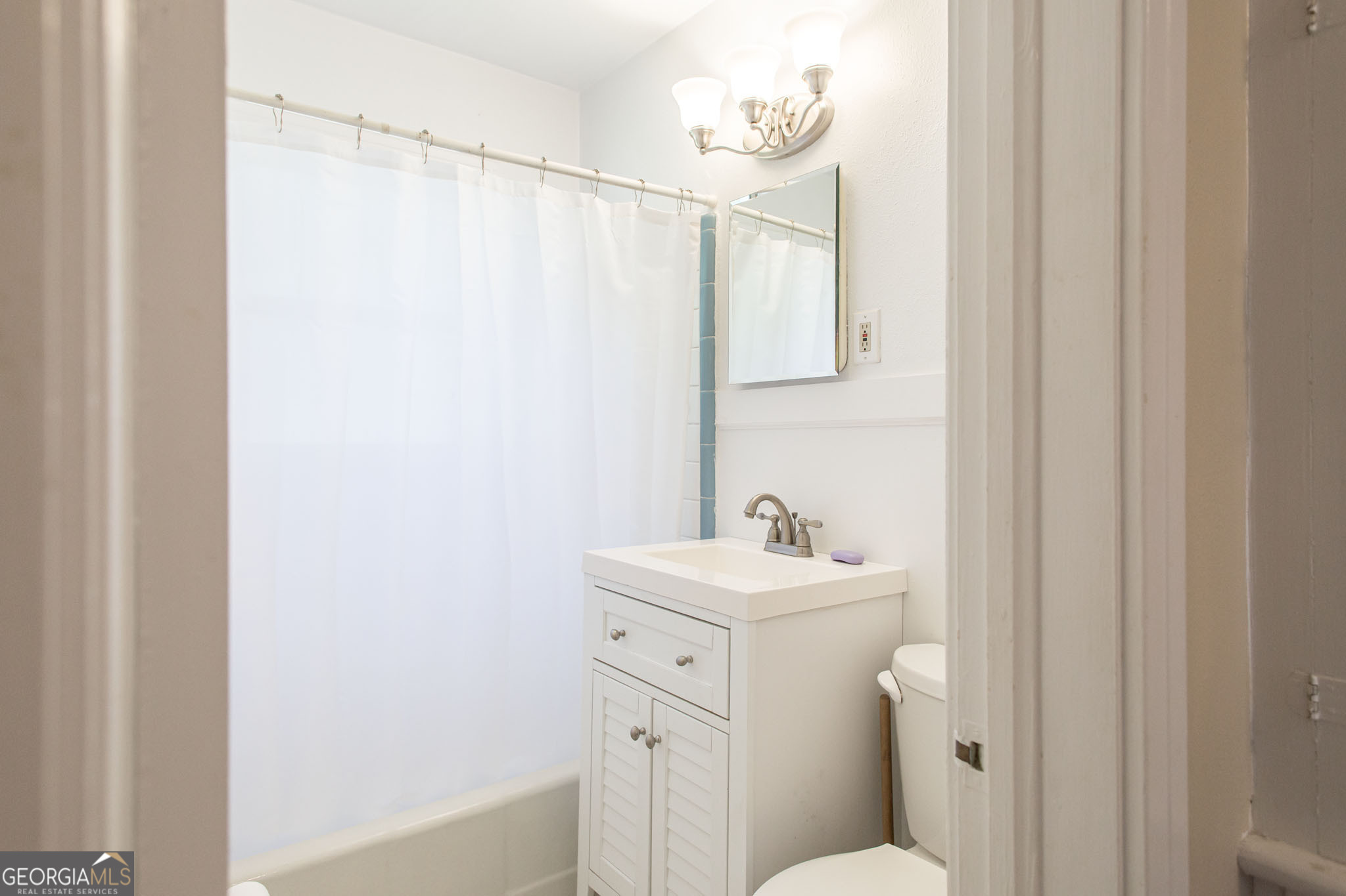 1009 Euclid Avenue Waycross, GA 31501 - Photo 16 of 35 a bathroom with a sink a toilet and shower